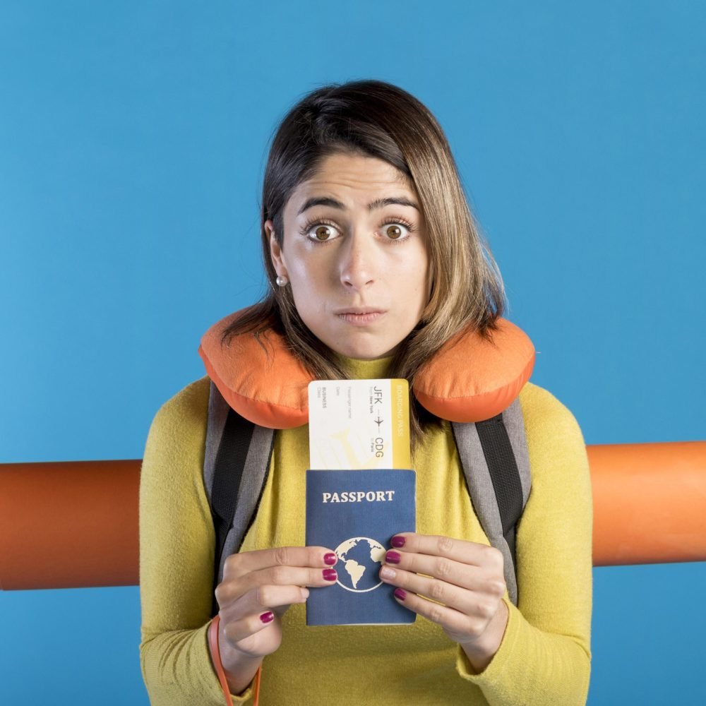 front-view-woman-holding-passport front-view-woman-holding-passport