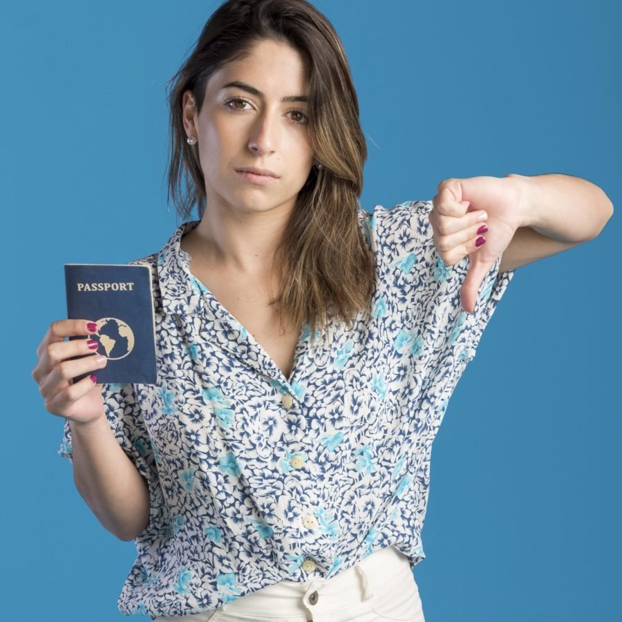 medium-shot-woman-holding-passport medium-shot-woman-holding-passport